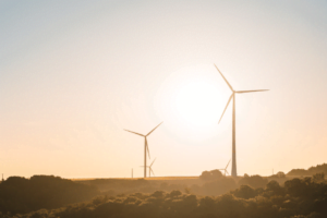 Wind power plant at sunrise