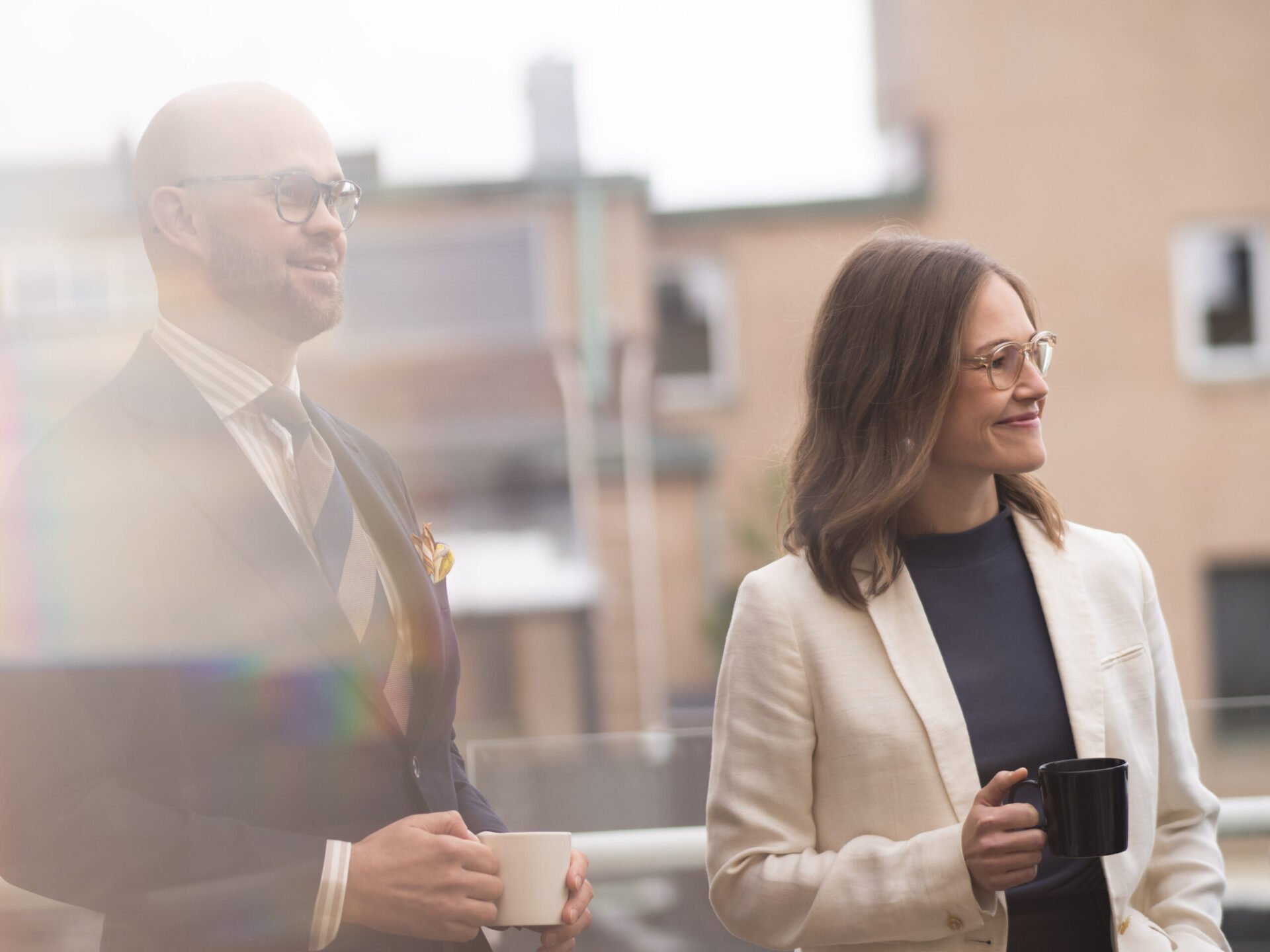 Employees smiling on the balcony