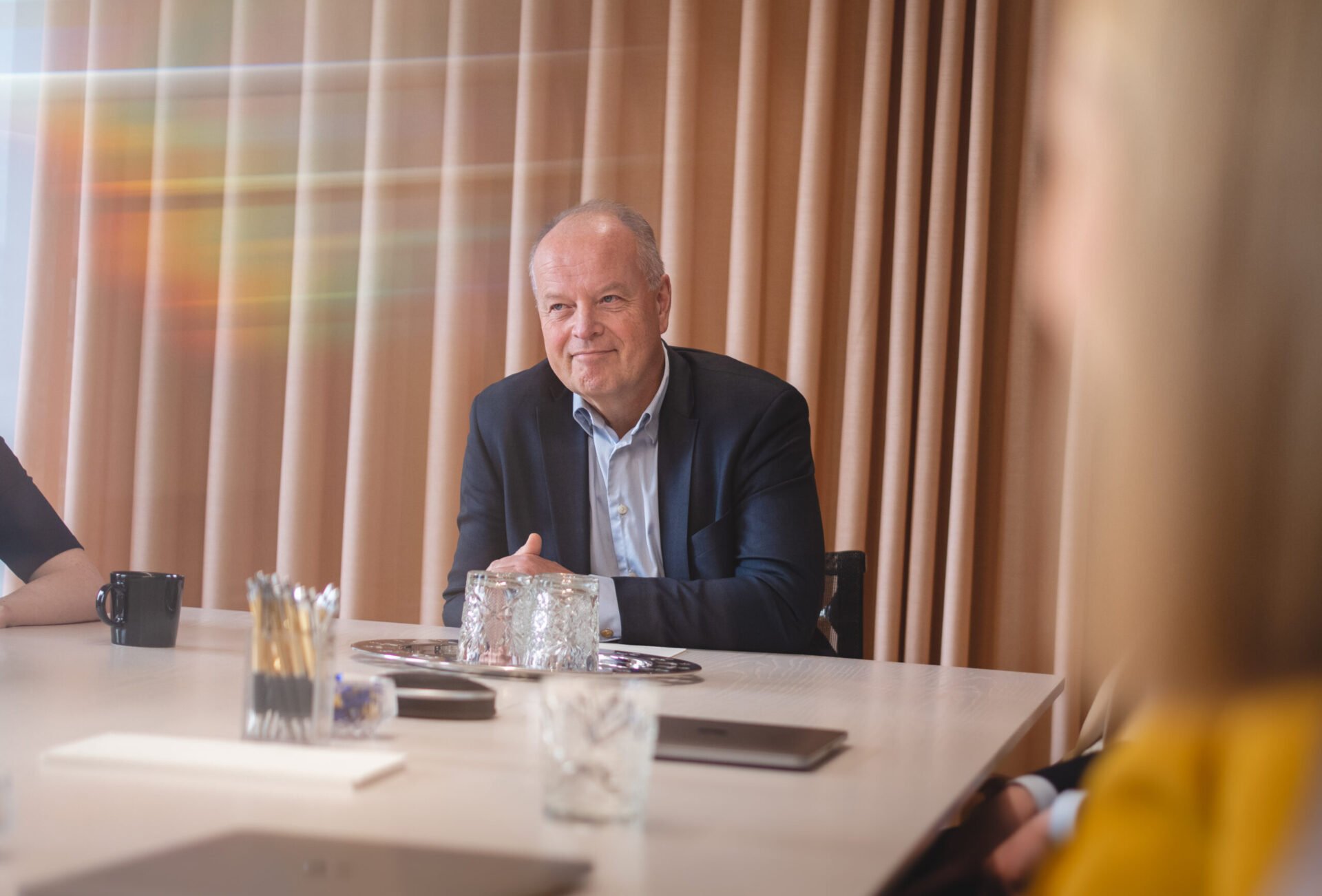 Law firm partner smiling in a professional setting