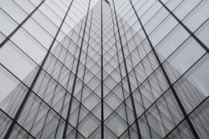 Modern grey glass building with reflective surfaces